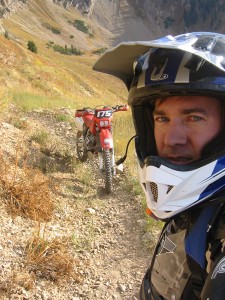 Shaun Roundy and his motorcycle near the top of Lightning Pass